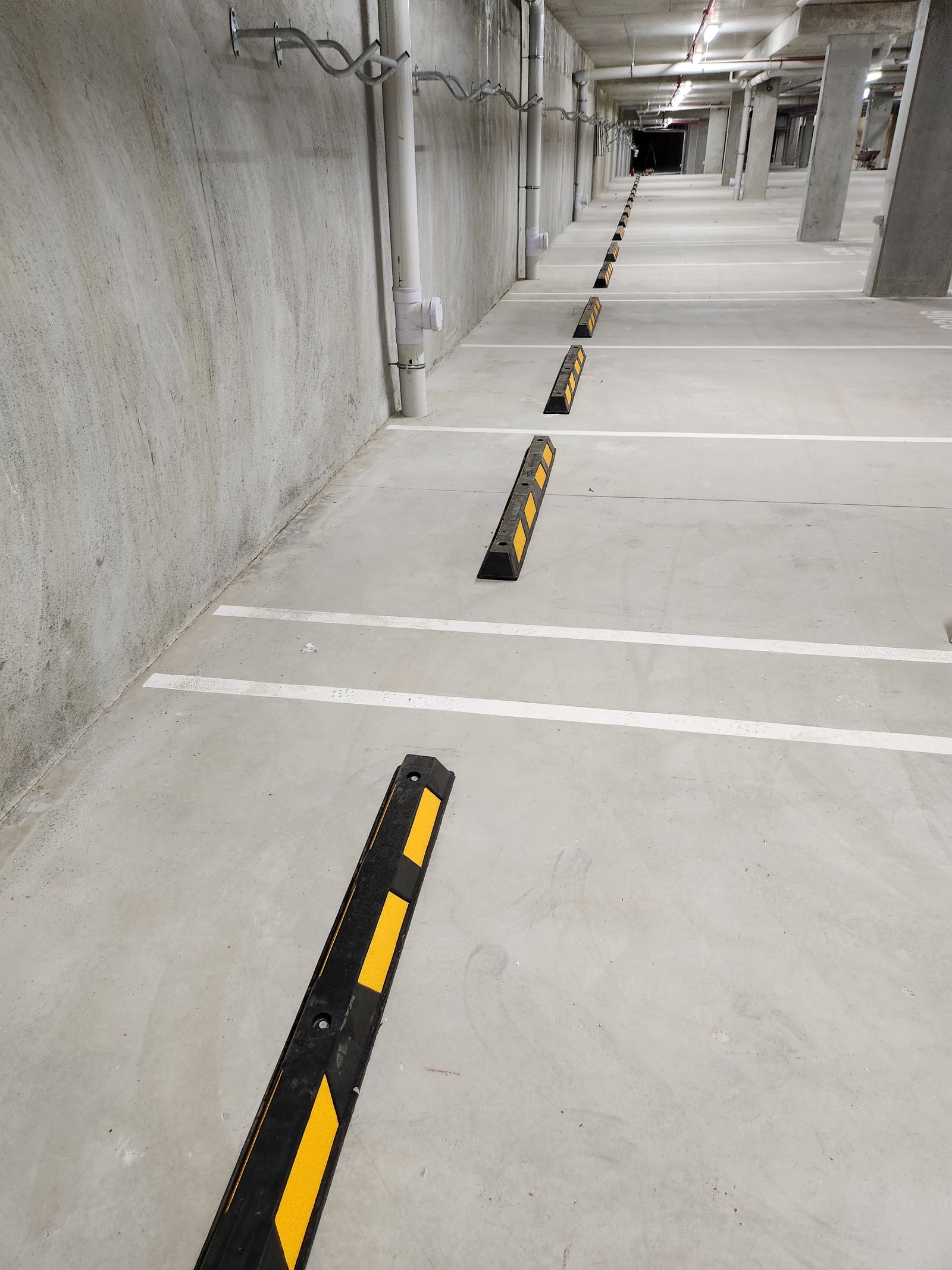 Wheel stops installed in a car park